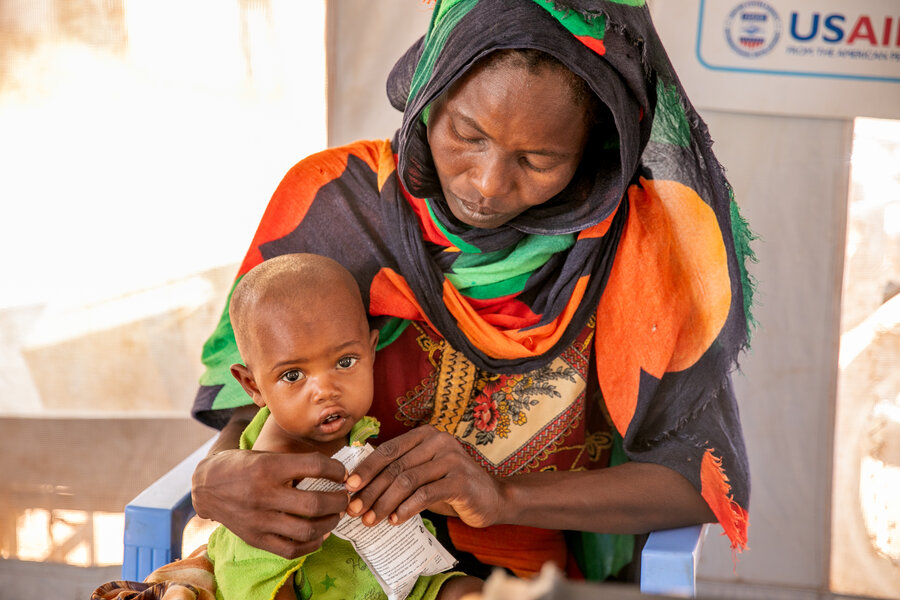 Sudanese refugees Zahara and her daughter Moona, who is recovering from malnutrition with WFP nutritional supplements. Photo: WFP/Eulalia Berlanga